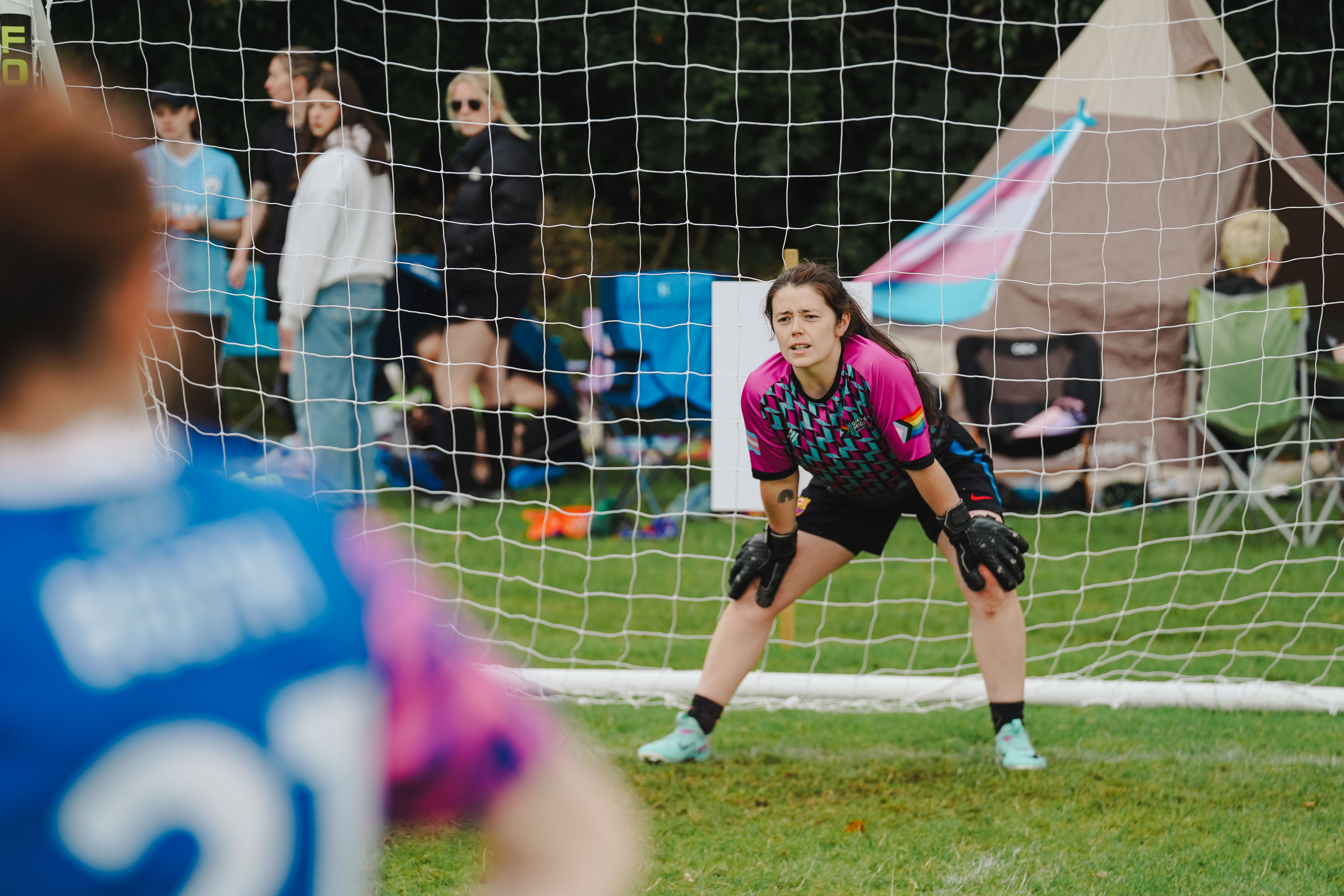 A goalkeeper standing in goal during a match