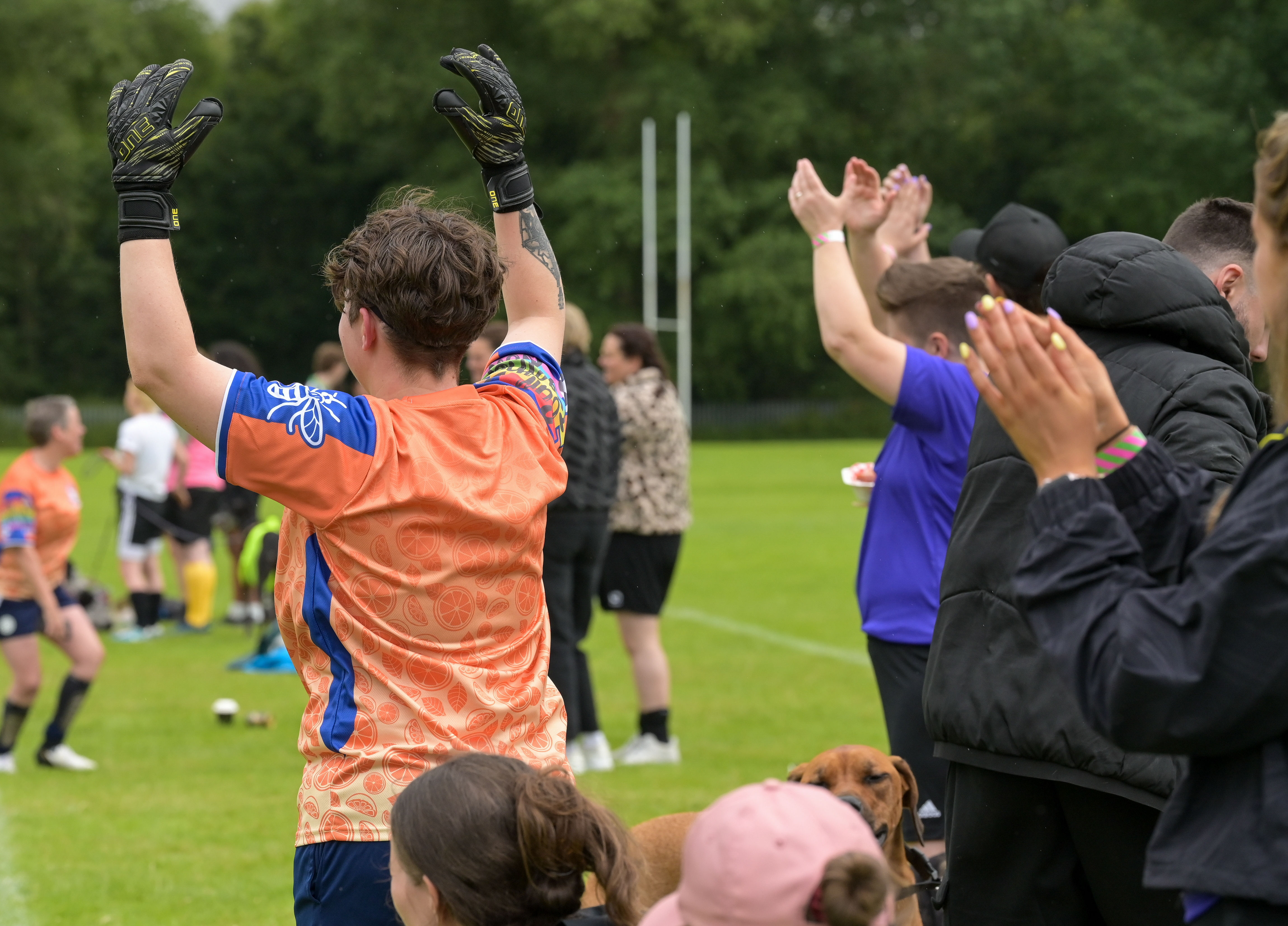 A group of players with their backs to camera reacting to a match